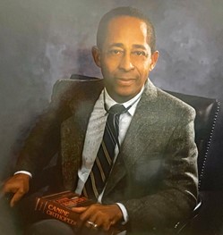 Dr. Pearce Louisy