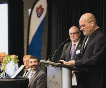 Man speaking at podium